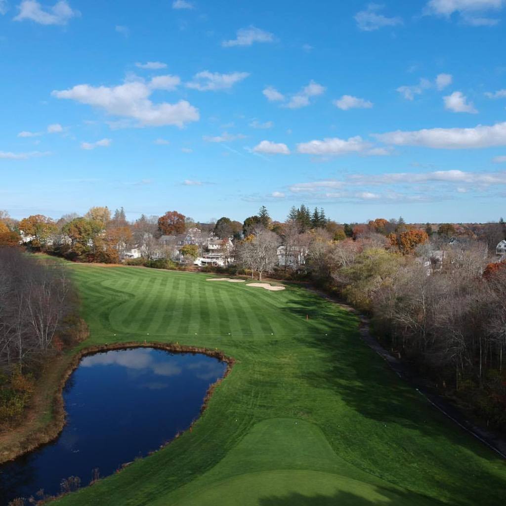 Golf course fairway with manicured greens